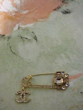 Gold-Tone Crystal Safety Pin Brooch with CC Charm